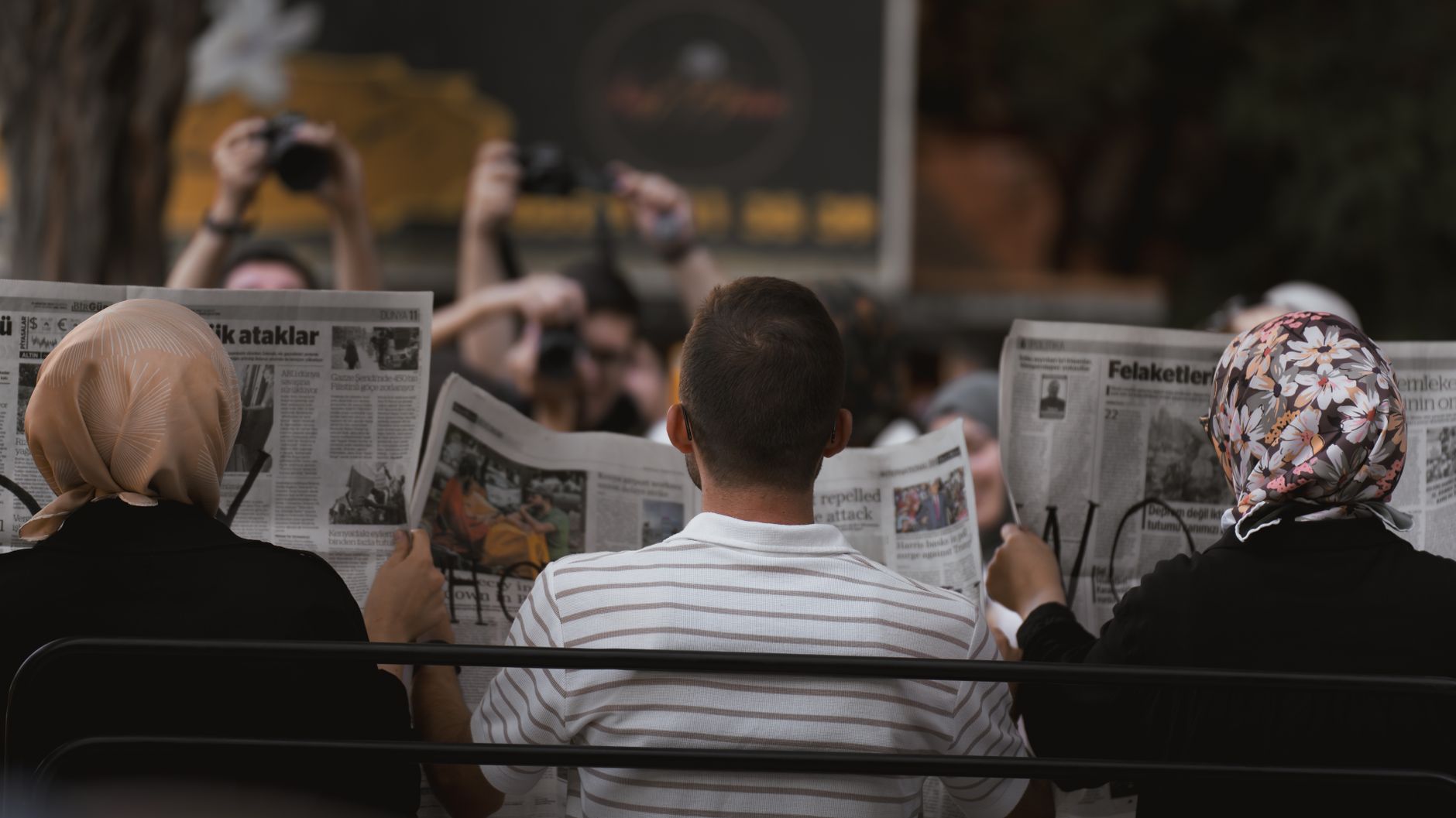 A candid moment of people reading newspapers on a bench in Ankara park. — Mastering Profile Optimization for Safe Balkan Dias