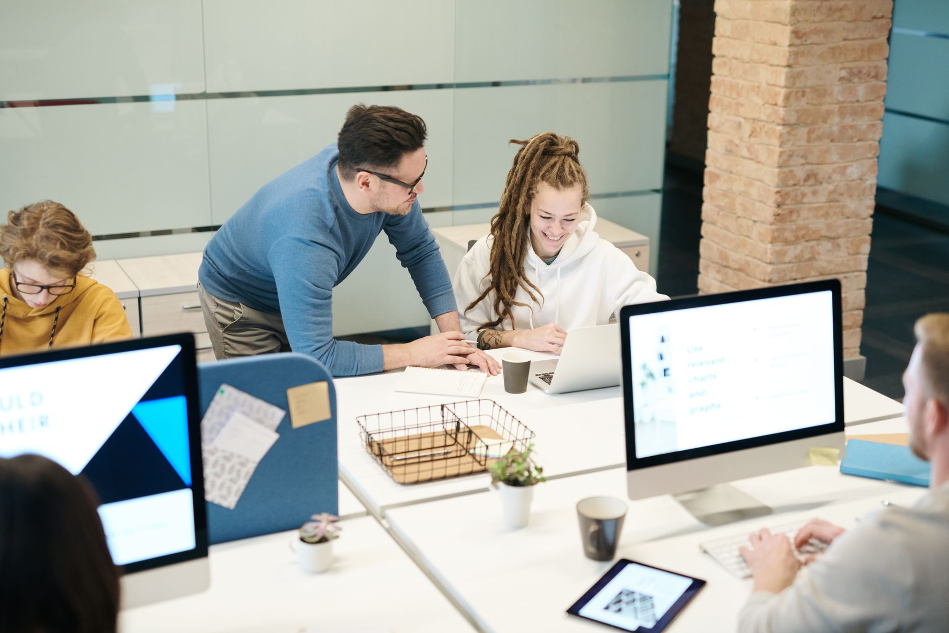 A diverse team of colleagues working together in a modern office environment. — Simplifying Furniture Removal in Austin: A Co
